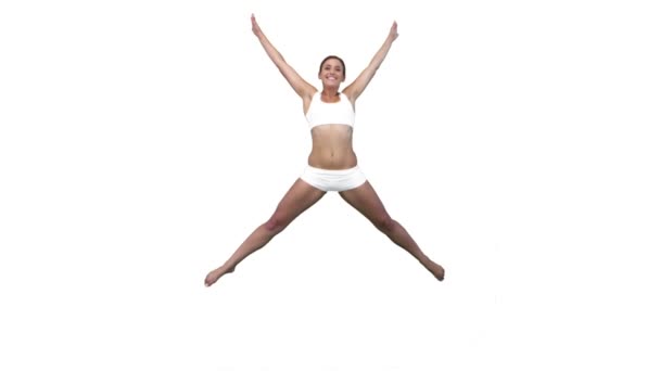 Mulher pulando em câmera lenta enquanto faz um salto de estrela — Vídeo de Stock