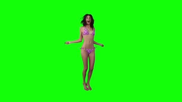 A woman in a bikini is using a skipping rope — Stock Video