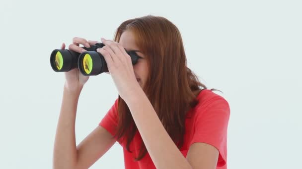 Laughing brunette haired looking through binoculars — Stock Video