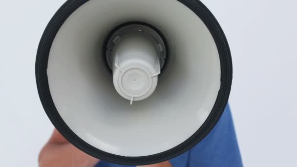 Angry young man using a megaphone — Stock Video