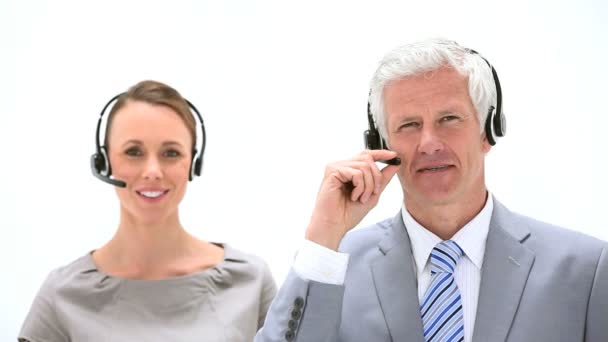 Business talking into headset — Stock Video