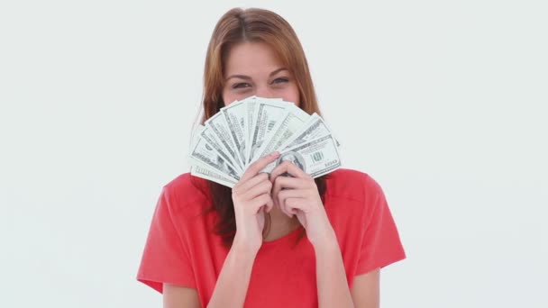 Laughing brunette haired woman holding US dollars — Stock Video