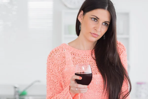 Sad woman holding glass of wine — Stock Photo, Image