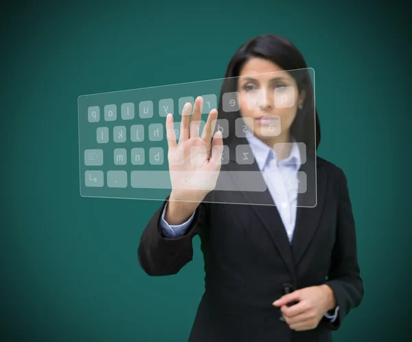Empresária tocando teclado digital projetado — Fotografia de Stock