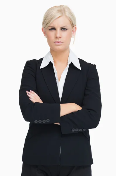 Serious blond businesswoman arms crossed — Stock Photo, Image