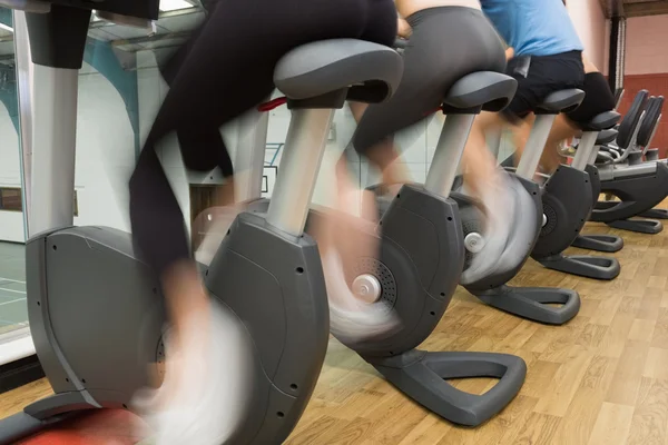 Riding on exercise bikes — Stock Photo, Image