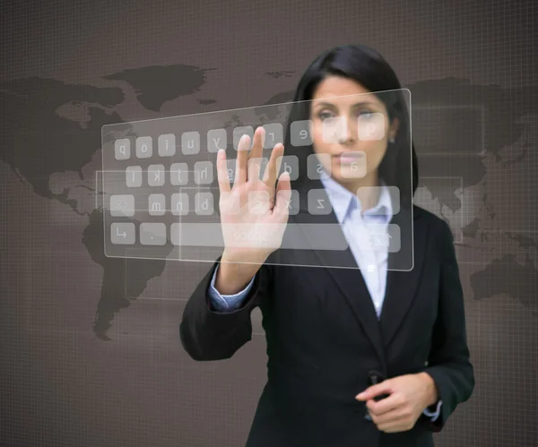 Businesswoman typing on projected digital keyboard — Stock Photo, Image
