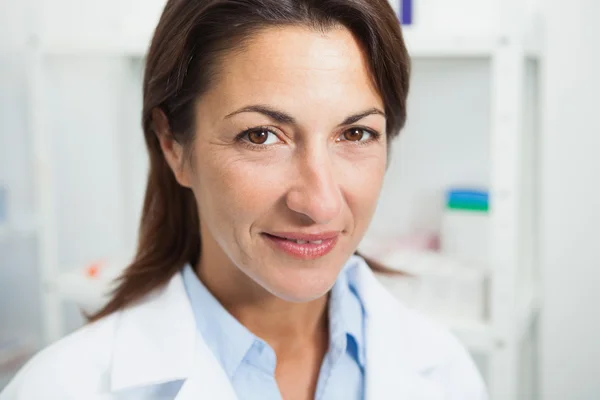 Smiling doctor in chemist — Stock Photo, Image