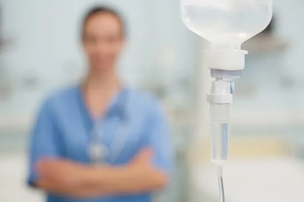 Phial in front of a nurse — Stock Photo, Image