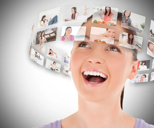 Mujer viendo fotos alrededor de su cabeza —  Fotos de Stock