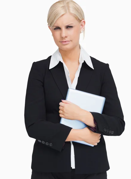 Serious businesswoman holding a tactile tablet — Stock Photo, Image