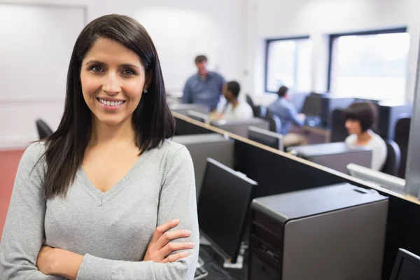 Woman smiling and standing in the front — Stock Photo, Image