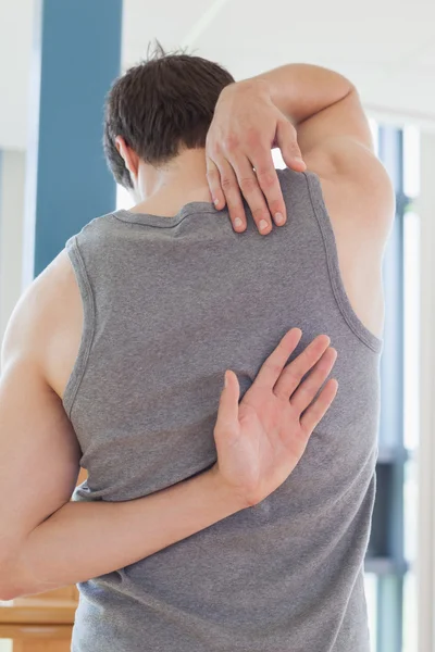 Man is stretching arms — Stock Photo, Image