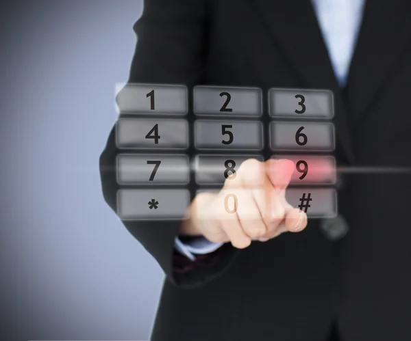 Woman pressing number on digital number pad Stock Picture