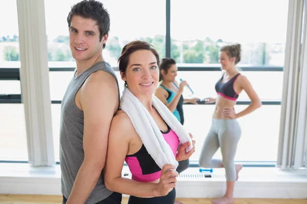 Man and woman standing back to back — Stock Photo, Image