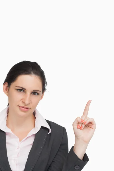 Brunette woman pointing up — Stock Photo, Image