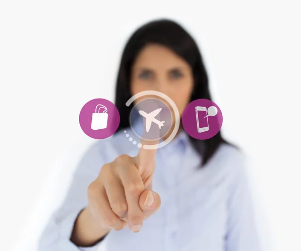 Woman touching airplane symbol — Stock Photo, Image