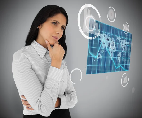 Business woman looking at world map hologram — Stock Photo, Image