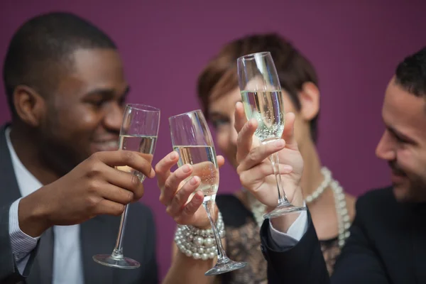 Three toasting and celebrating in a casino — Stock Photo, Image
