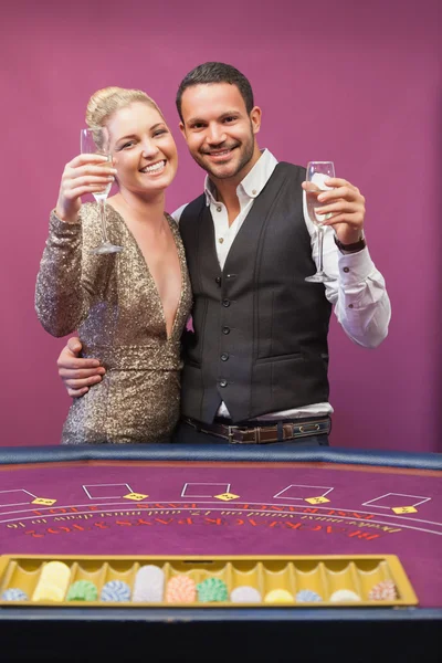 Two toasting in a casino — Stock Photo, Image