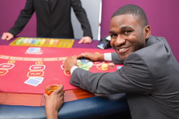 Happy man taking his winnings — Stock Photo, Image