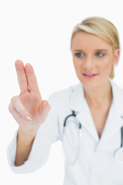 Doctor touching on something with two fingers — Stock Photo, Image