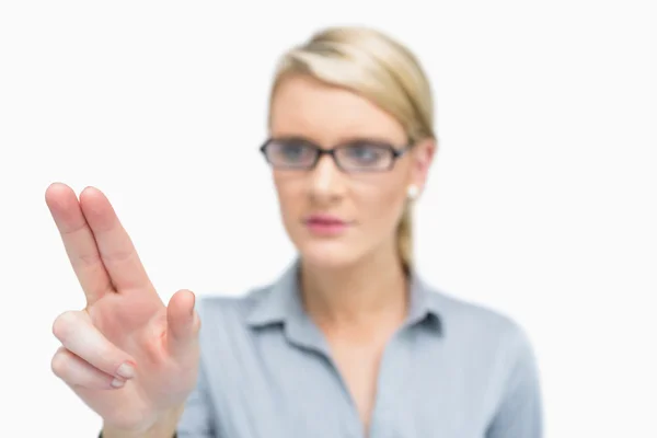 Businesswoman using two fingers to point — Stock Photo, Image