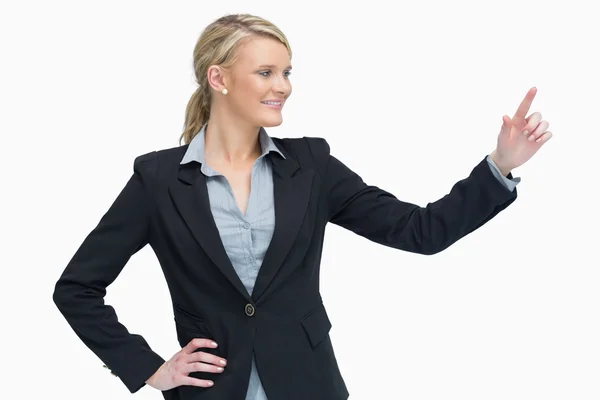 Smiling businesswoman presenting Stock Image