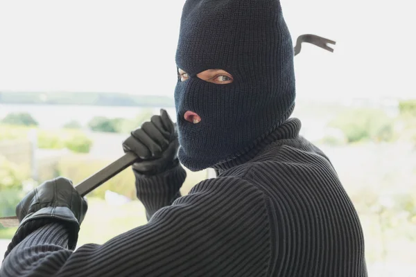 Robber with a crow bar — Stock Photo, Image