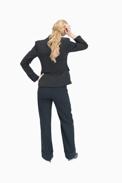 Thinking businesswoman backwards — Stock Photo, Image