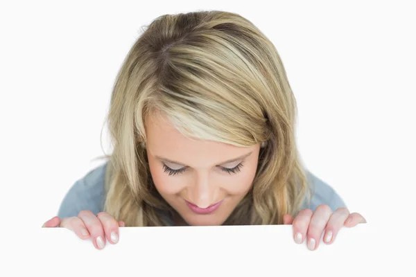 Woman looking down at the notice — Stock Photo, Image