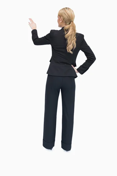 Reversed businesswoman showing something — Stock Photo, Image