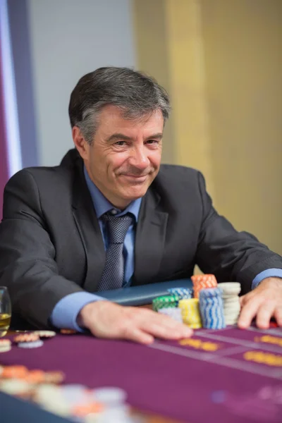 Smiling man with his chips — Stock Photo, Image