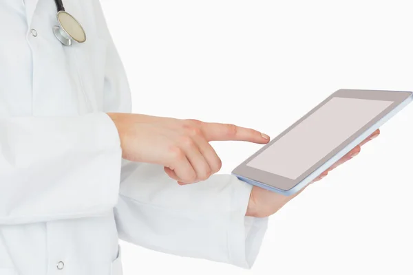 Doctor pointing on a tablet pc — Stock Photo, Image