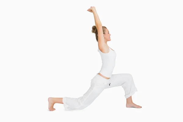 Woman in low lunge yoga pose — Stock Photo, Image