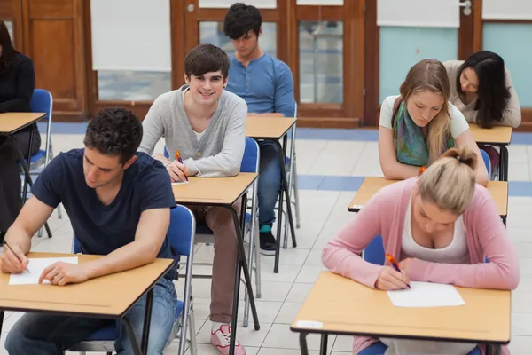 Students sitting in exam room Royalty Free Stock Images