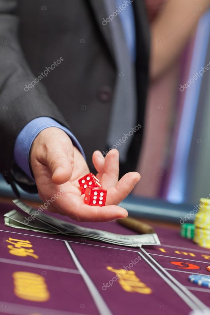 Man holding dice — Stock Photo © Wavebreakmedia 23092692