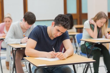 Students in an exam clipart