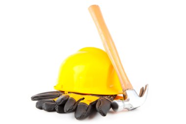 Claw hammer leaning against hard hat and builder's gloves clipart