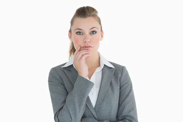 Businesswoman touching her cheek — Stock Photo, Image