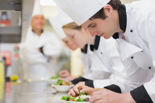 Culinary class in kitchen making salads — Stock Photo, Image