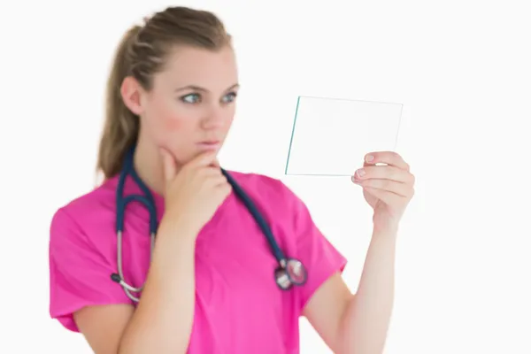 Female doctor looking at the pane — Stock Photo, Image