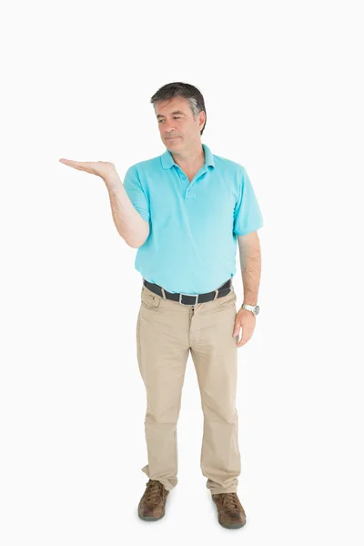 Man looking at his hand — Stock Photo, Image