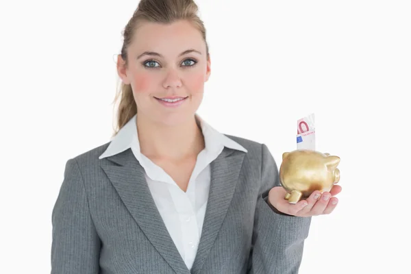 Businesswoman saving money — Stock Photo, Image