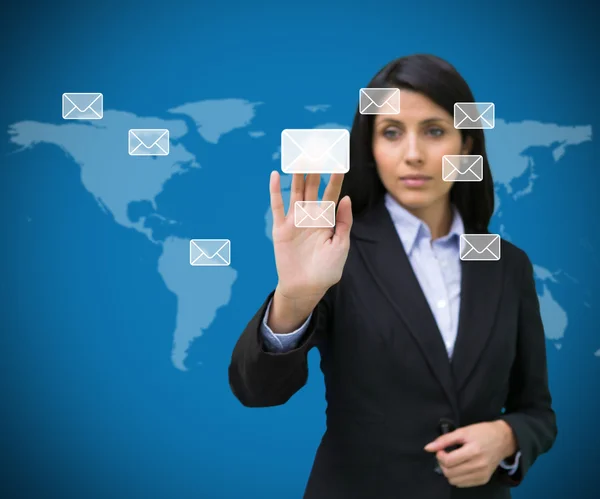 Businesswoman selecting email symbol from many — Stock Photo, Image