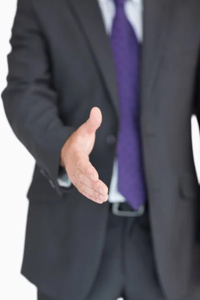 Businessman extending hand — Stock Photo, Image