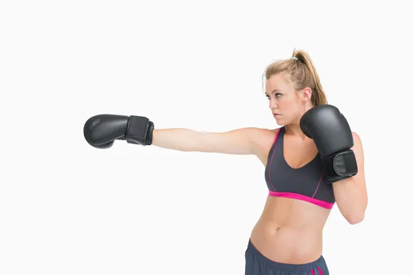 Female boxer punching — Stock Photo, Image