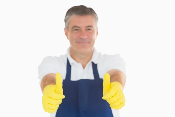 Hombre dando pulgares en guantes de goma —  Fotos de Stock