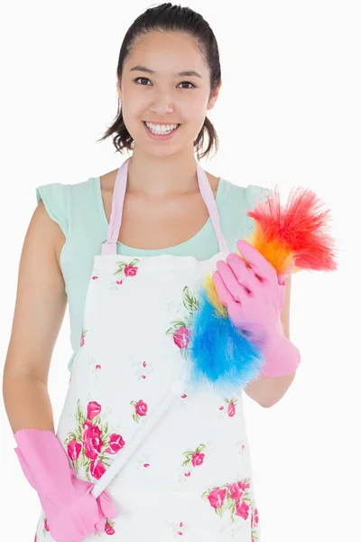 Woman holding a duster — Stock Photo, Image