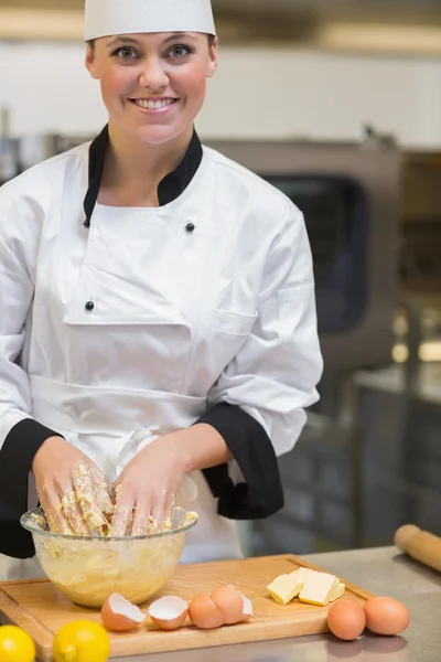 Smiling chef preparing the dough — Stock Photo, Image